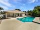 Inviting pool area perfect for relaxation and entertainment with screened in patio at 1818 Portview Ave, Deltona, FL 32738