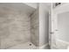 Updated shower features modern tile and fixtures, providing a spa-like experience at 1924 Lake Atriums Cir # 52, Orlando, FL 32839