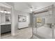 Bright bedroom features a white bunk bed, wood-look floors, and a stylish dresser with modern decor at 1924 Lake Atriums Cir # 52, Orlando, FL 32839