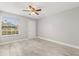 Clean bedroom with ample natural light, neutral paint, tile floor and ceiling fan at 1924 Lake Atriums Cir # 52, Orlando, FL 32839