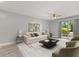 Bright living room with contemporary decor, neutral paint, and sliding door to backyard area at 1924 Lake Atriums Cir # 52, Orlando, FL 32839