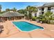 The community pool has several lounge chairs for residents to relax and enjoy the sun at 1924 Lake Atriums Cir # 52, Orlando, FL 32839