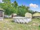 An above ground pool is the focal point of this backyard, complete with multiple storage sheds for organized outdoor living at 219 E Fern Dr, Orange City, FL 32763