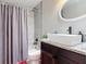Bathroom with shower, toilet, vessel sink, and dark wood vanity at 219 E Fern Dr, Orange City, FL 32763