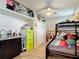 Bedroom features built-in storage, bunk beds, and laminate wood floors at 219 E Fern Dr, Orange City, FL 32763