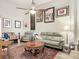 Cozy living room with comfortable seating, stylish decor, and ample natural light at 219 E Fern Dr, Orange City, FL 32763