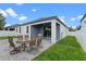 Spacious outdoor patio with a dining set that leads to a sliding glass door at 2210 Romanum Dr, Winter Garden, FL 34787