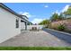 Large backyard patio with dining set, privacy fence and raised brick planter at 2210 Romanum Dr, Winter Garden, FL 34787