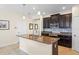 Modern kitchen featuring granite countertops, a center island, and stainless steel appliances at 2210 Romanum Dr, Winter Garden, FL 34787