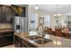 Spacious kitchen with granite countertops, stainless steel appliances, and a large island at 2210 Romanum Dr, Winter Garden, FL 34787