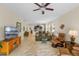 Spacious living room with tile flooring, comfortable seating, and an open view to the kitchen at 2210 Romanum Dr, Winter Garden, FL 34787