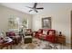 Cozy living room with ample natural light, comfortable seating, and stylish decor at 2210 Romanum Dr, Winter Garden, FL 34787