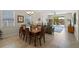 Bright, open-concept living and dining area with tile floors and sliding glass doors leading to the patio at 2210 Romanum Dr, Winter Garden, FL 34787