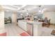 Open kitchen design with a center island, stainless steel appliances, and granite countertops at 236 Longhorn Dr, Apopka, FL 32712