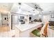 Well-lit kitchen featuring granite countertops, stainless steel appliances, and a breakfast bar at 236 Longhorn Dr, Apopka, FL 32712
