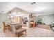 Bright kitchen area with stainless steel appliances and breakfast bar, seamlessly connected to living area at 236 Longhorn Dr, Apopka, FL 32712
