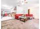 Open-concept living room with carpet and tile flooring adjacent to the kitchen at 236 Longhorn Dr, Apopka, FL 32712