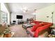 Comfortable living room with carpet flooring and large sofa, perfect for relaxation at 236 Longhorn Dr, Apopka, FL 32712