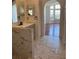 Hall bathroom with marble countertops and updated backsplash at 2421 Queenswood Cir, Kissimmee, FL 34743
