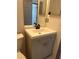 Bathroom featuring single sink, vanity with modern fixtures, and well-lit mirror at 2421 Queenswood Cir, Kissimmee, FL 34743