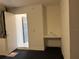 This room features a utility sink with plenty of shelves at 2421 Queenswood Cir, Kissimmee, FL 34743