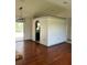 Hardwood floors with access to the kitchen and patio at 2421 Queenswood Cir, Kissimmee, FL 34743
