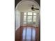 Bright living room with hardwood floors and bay window at 2421 Queenswood Cir, Kissimmee, FL 34743