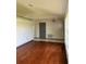 Spacious living room with hardwood floors and neutral walls at 2421 Queenswood Cir, Kissimmee, FL 34743