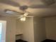 This office has neutral walls, a built in desk, and a ceiling fan at 2421 Queenswood Cir, Kissimmee, FL 34743