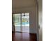 A beautiful view of the screened pool and lake view from inside the home at 2421 Queenswood Cir, Kissimmee, FL 34743