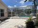 Enclosed pool and patio area, ideal for relaxing, entertaining, and enjoying the outdoors in a private setting at 2421 Queenswood Cir, Kissimmee, FL 34743