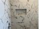 Updated shower with marble tile and shower niche at 2421 Queenswood Cir, Kissimmee, FL 34743