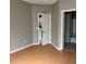 Bedroom with wood look floors showing a doorway to the kitchen and a bathroom at 2525 Maitland Crossing Way # 202, Orlando, FL 32810