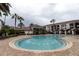 Stunning community pool with water features, poolside seating, and lush landscaping for ultimate relaxation at 2525 Maitland Crossing Way # 202, Orlando, FL 32810