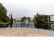 Picturesque pond featuring a fountain and surrounded by well-maintained landscaping and condominium buildings at 2525 Maitland Crossing Way # 202, Orlando, FL 32810