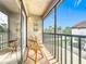 Outdoor balcony with tile flooring and chairs, perfect for relaxation with a view of the lush surroundings at 260 Killarney Bay Ct # 6-6, Winter Park, FL 32789
