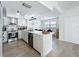 Modern kitchen with stainless steel appliances, subway tile backsplash, and center island with seating at 260 Killarney Bay Ct # 6-6, Winter Park, FL 32789