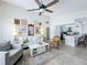 Open-concept living room featuring wood-look floors, and views of kitchen at 260 Killarney Bay Ct # 6-6, Winter Park, FL 32789