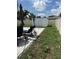 Backyard featuring a large, fenced yard with a storage shed and an outdoor seating area at 2648 Amsden Rd, Winter Park, FL 32792