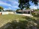 Backyard features an in-ground pool, large patio, awning, privacy fence and shed at 2648 Amsden Rd, Winter Park, FL 32792