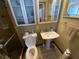 Bright bathroom featuring a single sink and enclosed shower with frosted glass doors at 2648 Amsden Rd, Winter Park, FL 32792