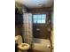 Bathroom with tiled walls, shower, and window with natural light at 2648 Amsden Rd, Winter Park, FL 32792