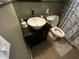Bathroom featuring a vanity sink with unique bronze fixtures and a toilet at 2648 Amsden Rd, Winter Park, FL 32792