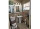 This bathroom features a pedestal sink, tile flooring, and plenty of storage space at 2648 Amsden Rd, Winter Park, FL 32792