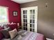 Another view of this bedroom with beautiful doors, offering style and comfort at 2648 Amsden Rd, Winter Park, FL 32792
