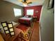 Cozy bedroom with a large bed, colorful rug, and stylish decor at 2648 Amsden Rd, Winter Park, FL 32792