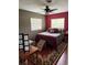 A bright bedroom features a comfortable bed, stylish furnishings, and lots of natural light at 2648 Amsden Rd, Winter Park, FL 32792