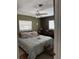 Bedroom featuring neutral tones, natural lighting, and functional furniture at 2648 Amsden Rd, Winter Park, FL 32792