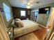 Bright bedroom with ceiling fan, spacious closet, and window views at 2648 Amsden Rd, Winter Park, FL 32792