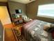 Comfortable bedroom featuring a chaise lounge and mounted TV for relaxation at 2648 Amsden Rd, Winter Park, FL 32792